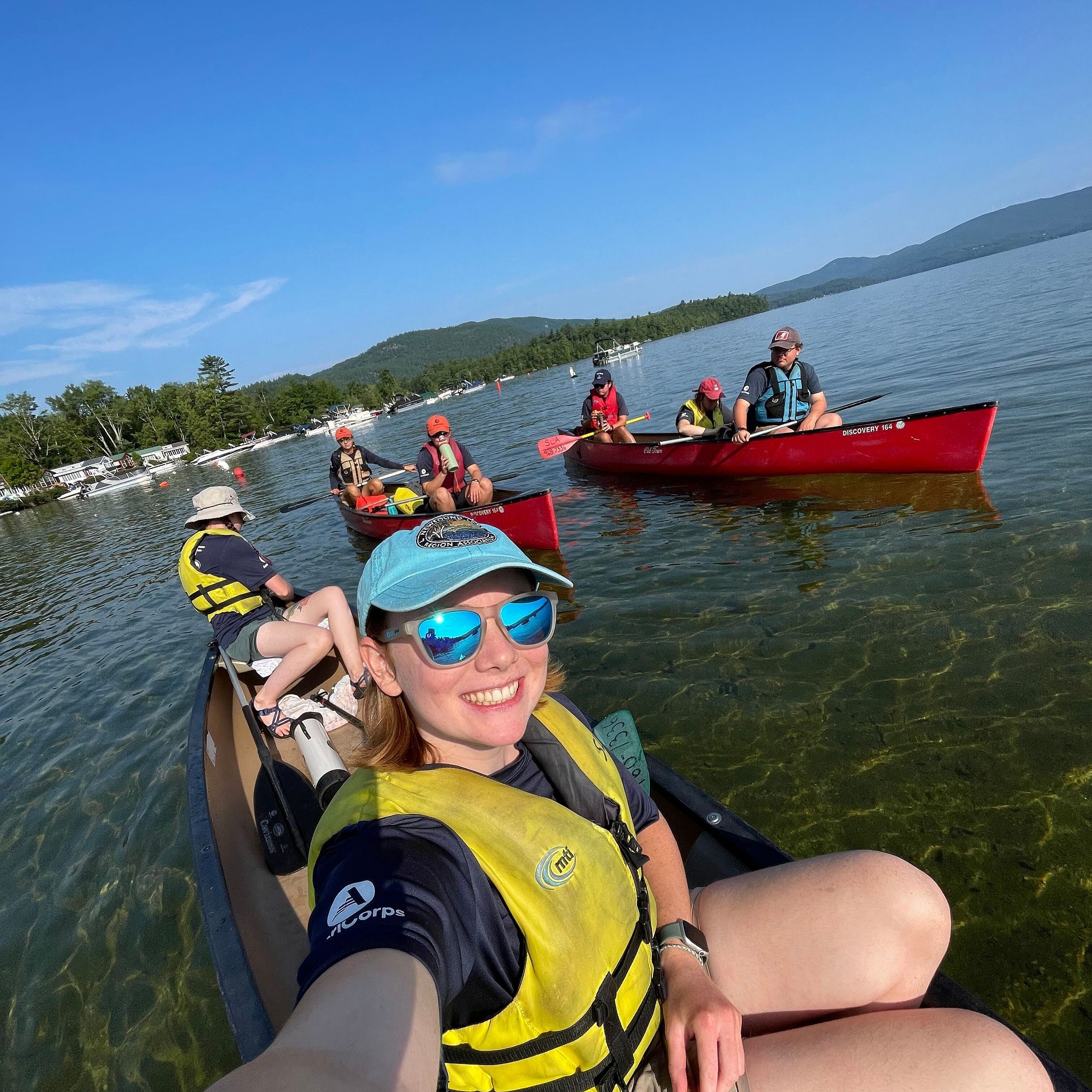 kayakers set out to search for invasive aquatic plants during the Weed Stampede on Newfound Lake.