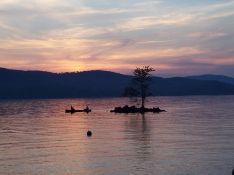 boaters paddling at sunrise
