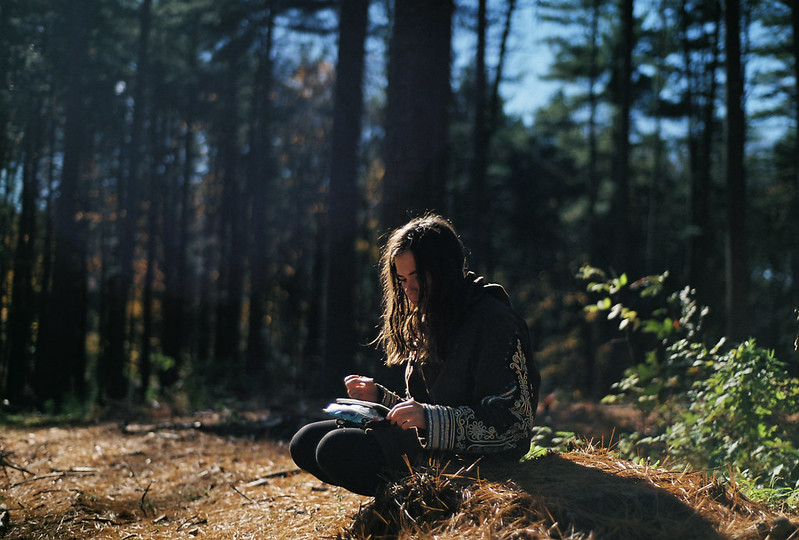 woman with nature journal